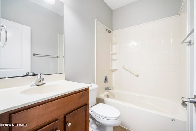 full bathroom with toilet, tiled shower / bath combo, and vanity