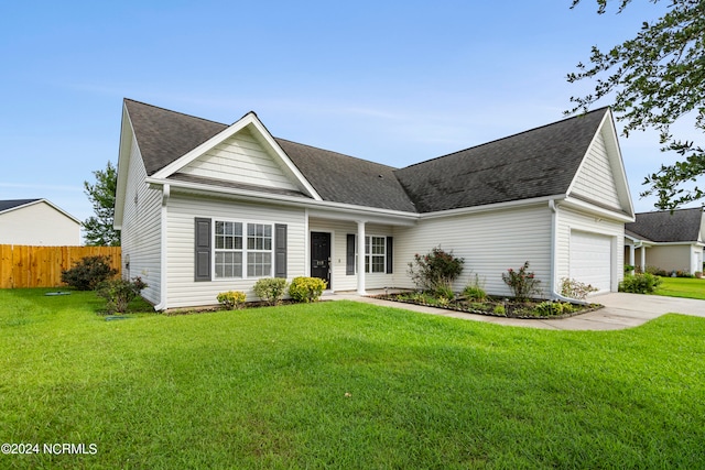 view of front of home featuring a garage and a front yard