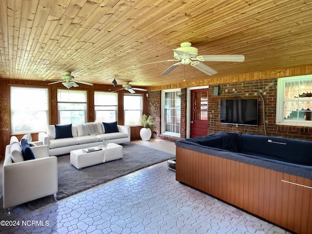 living room featuring brick wall and wooden ceiling