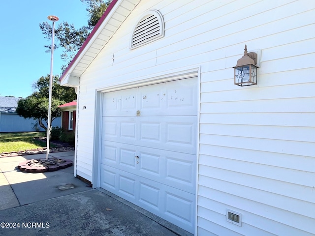 garage featuring wood walls