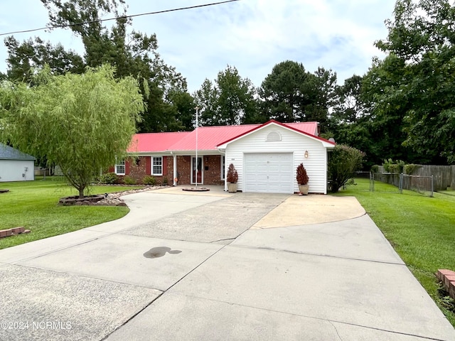 ranch-style home with a garage and a front lawn