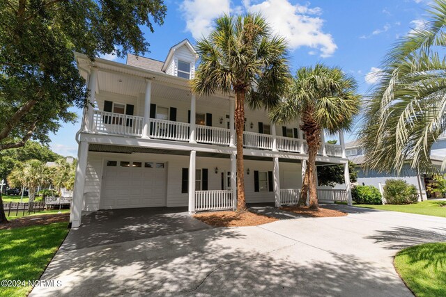 back of property featuring a water view