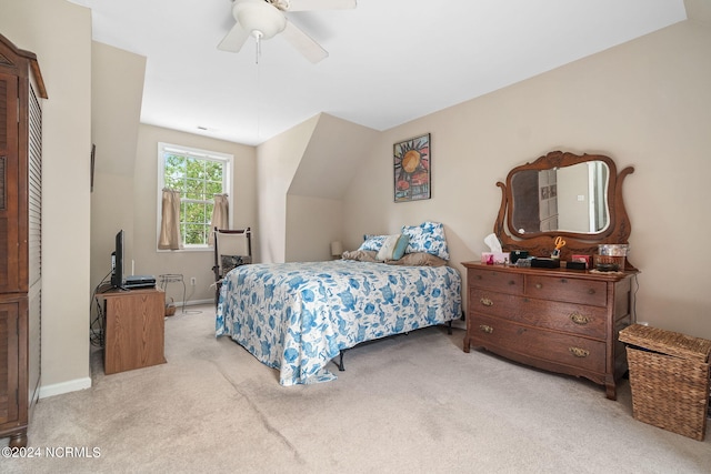 carpeted bedroom with lofted ceiling and ceiling fan