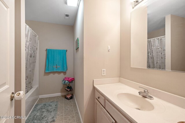 bathroom featuring vanity, tile patterned floors, and shower / bath combination with curtain