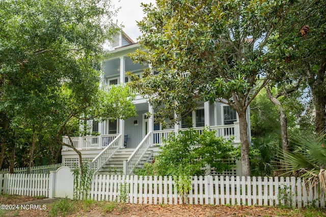 obstructed view of property with covered porch