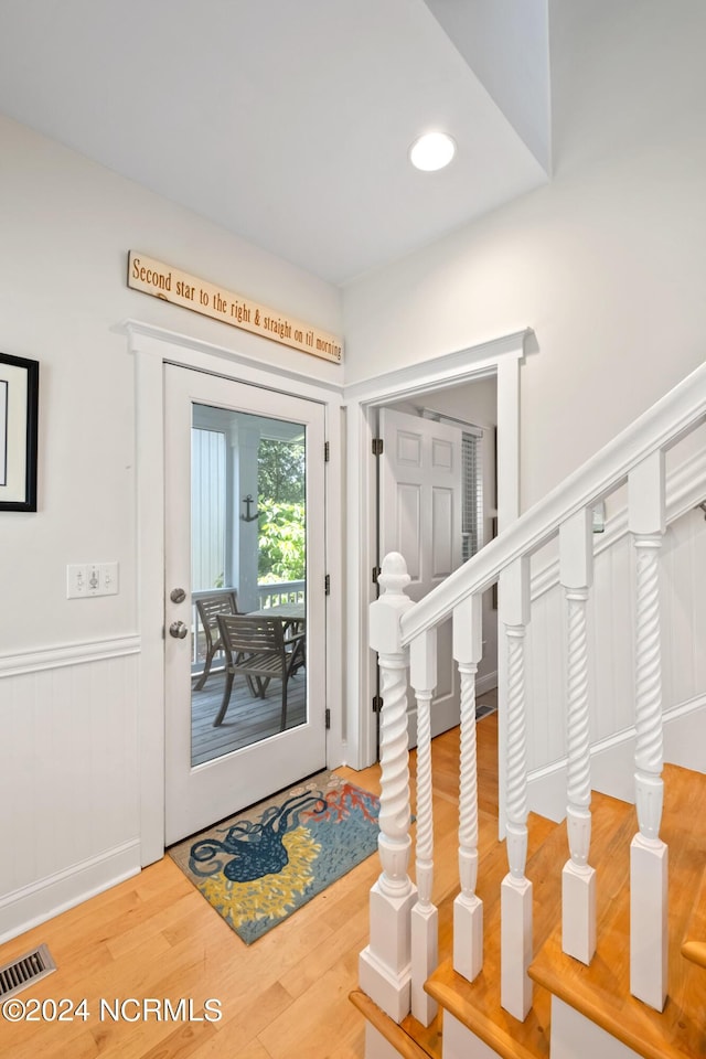 604 Currituck Way, Bald Head Island, NC 28461 - entryway featuring wood finished floors, wainscoting, and recessed lighting