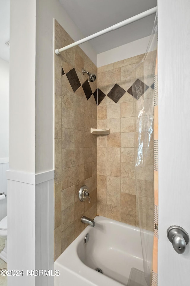 604 Currituck Way, Bald Head Island, NC 28461 - full bathroom with shower / bath combination and a wainscoted wall