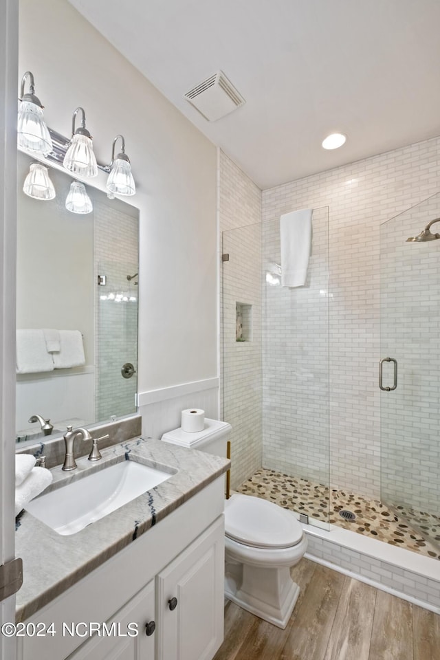 604 Currituck Way, Bald Head Island, NC 28461 - bathroom featuring wood finished floors, a shower stall, and vanity