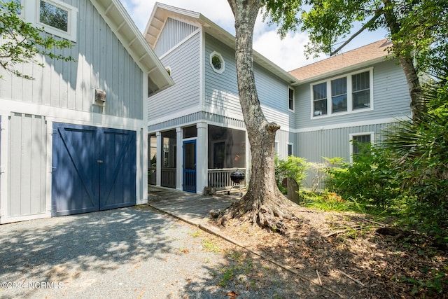 604 Currituck Way, Bald Head Island, NC 28461 - rear view of property with a sunroom