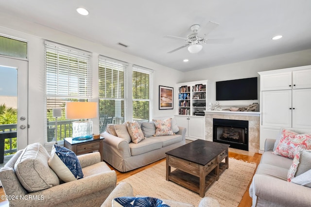 604 Currituck Way, Bald Head Island, NC 28461 - living room featuring light wood finished floors, ceiling fan, a tiled fireplace, and recessed lighting