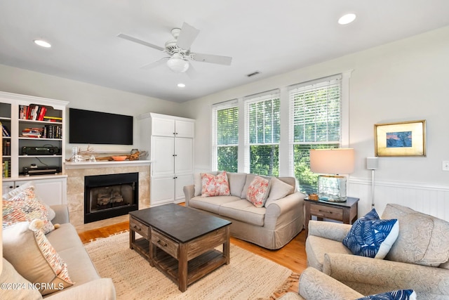 604 Currituck Way, Bald Head Island, NC 28461 - living area with light wood-type flooring, wainscoting, a ceiling fan, a fireplace, and recessed lighting