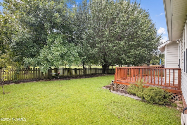 view of yard featuring a wooden deck