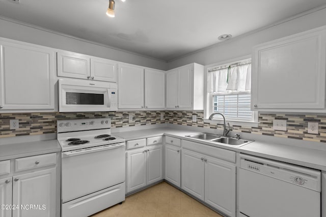 kitchen featuring white cabinets, white appliances, sink, light tile patterned floors, and decorative backsplash