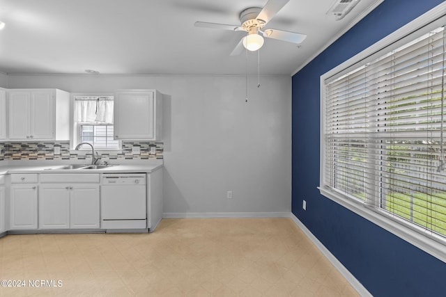 kitchen with white dishwasher, sink, light tile patterned floors, decorative backsplash, and white cabinetry