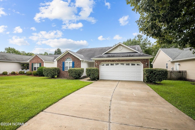 single story home with a garage and a front yard