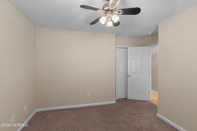 unfurnished room featuring light carpet and ceiling fan