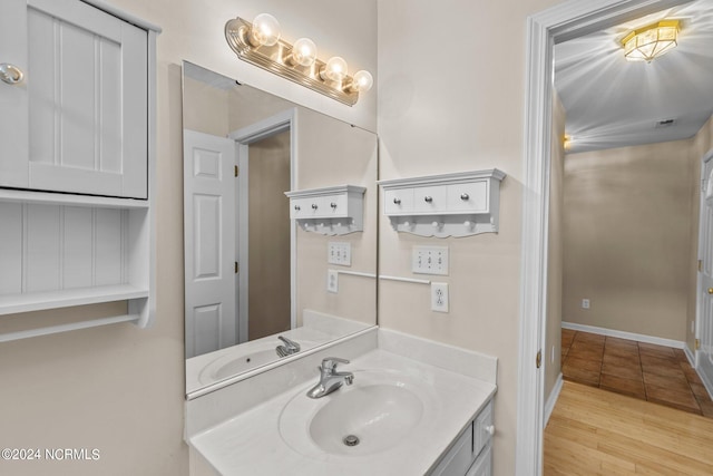 bathroom featuring vanity and hardwood / wood-style flooring