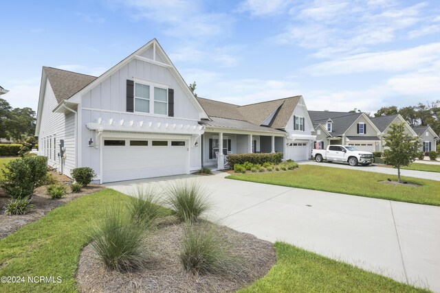 view of front of house with a garage and a front yard