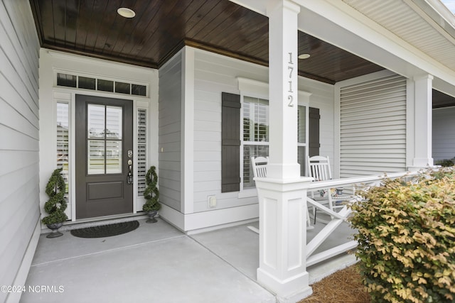 doorway to property with covered porch