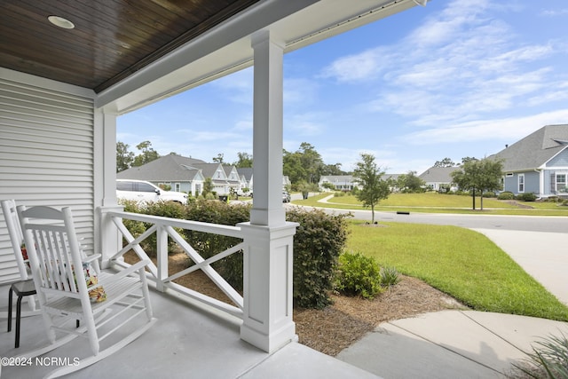 view of patio with a residential view and a porch