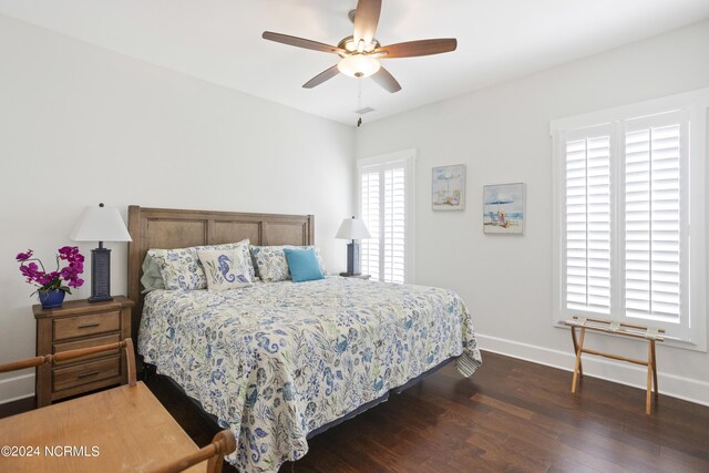 bedroom with dark wood-type flooring and ceiling fan