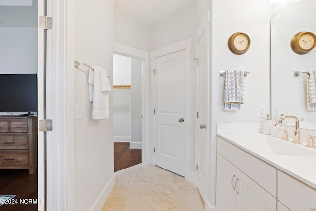 bathroom with vanity and hardwood / wood-style floors