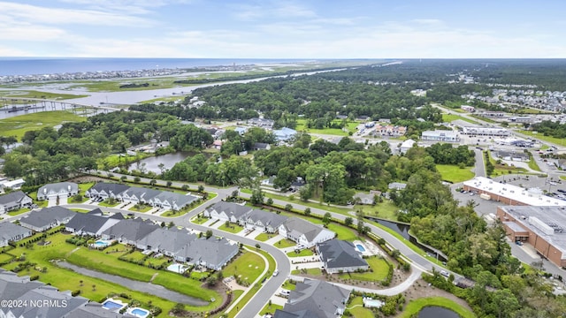 drone / aerial view featuring a water view and a residential view