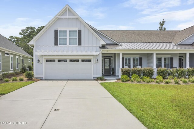 view of front facade with a garage and a front yard