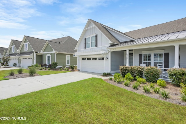 view of front of house featuring a front yard and a garage