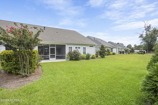 view of yard featuring a sunroom