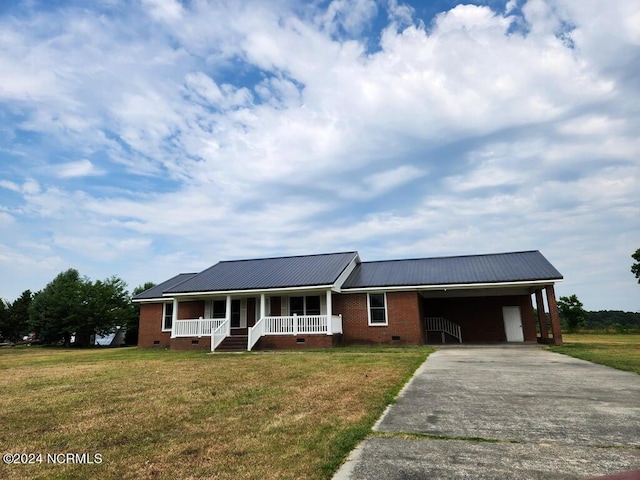 single story home with a porch, a carport, and a front lawn