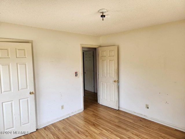 spare room with light wood-type flooring