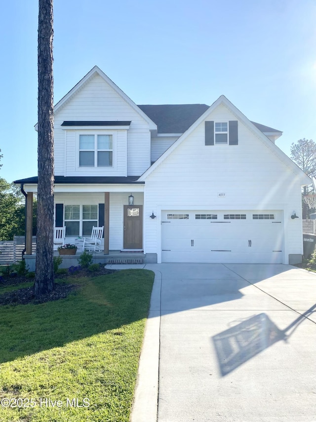 view of front of house featuring driveway, a garage, a porch, and a front yard