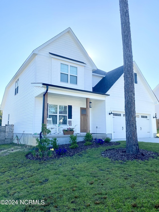 view of front facade with a front yard and covered porch