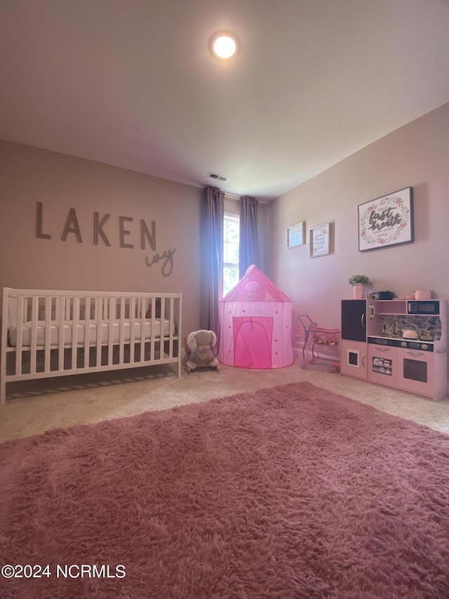 unfurnished bedroom with carpet and visible vents