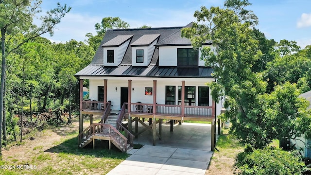 modern farmhouse with a carport and covered porch