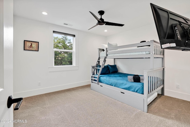 carpeted bedroom featuring ceiling fan