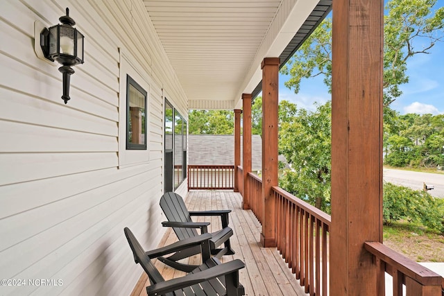 wooden terrace featuring a porch