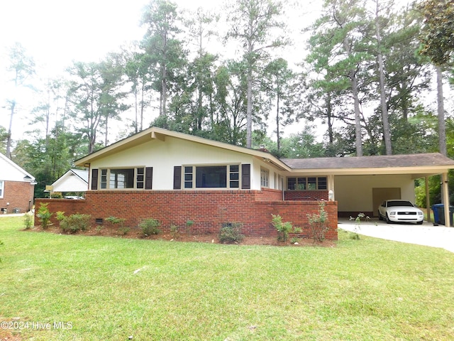 single story home with a front lawn and a carport