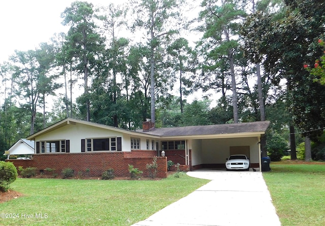 ranch-style home featuring a front yard and a carport