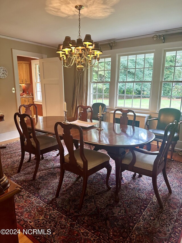 living room featuring ornamental molding, coffered ceiling, beam ceiling, and light wood-type flooring