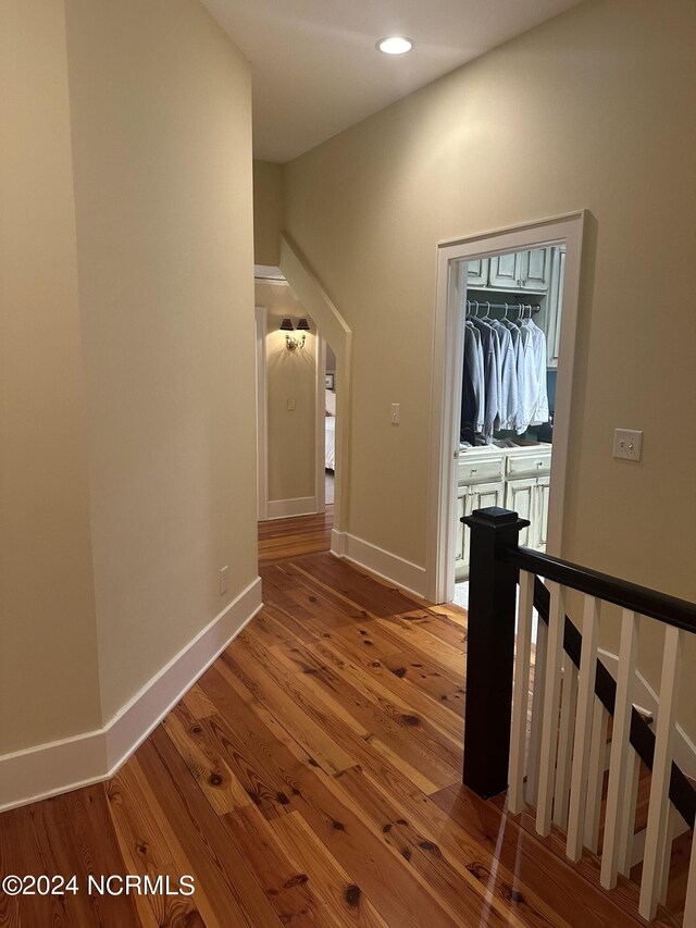 interior space featuring coffered ceiling, hardwood / wood-style floors, french doors, and beamed ceiling