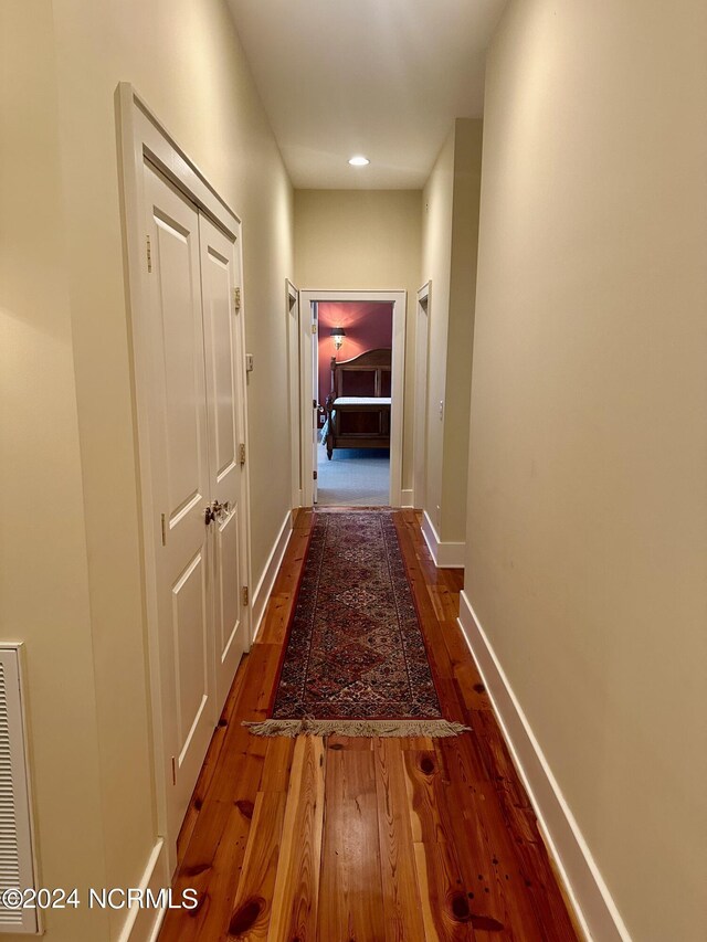 living area featuring hardwood / wood-style flooring, ornamental molding, indoor bar, and decorative columns