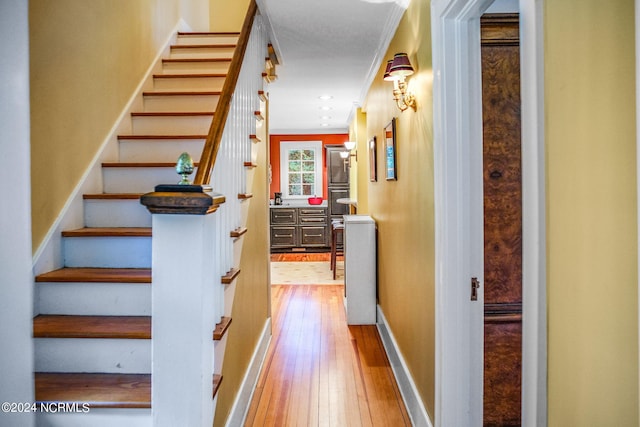 stairs featuring wood-type flooring