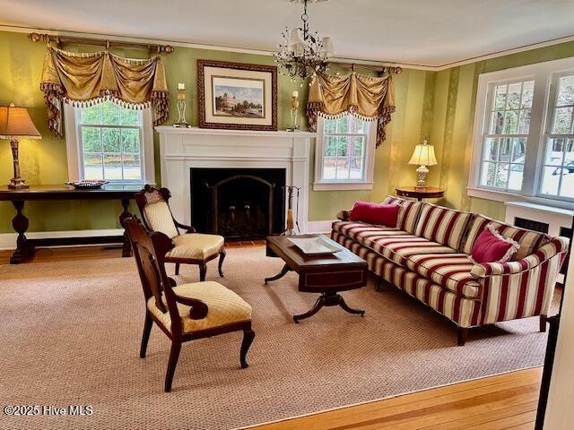 bedroom featuring ornamental molding, carpet floors, and multiple windows