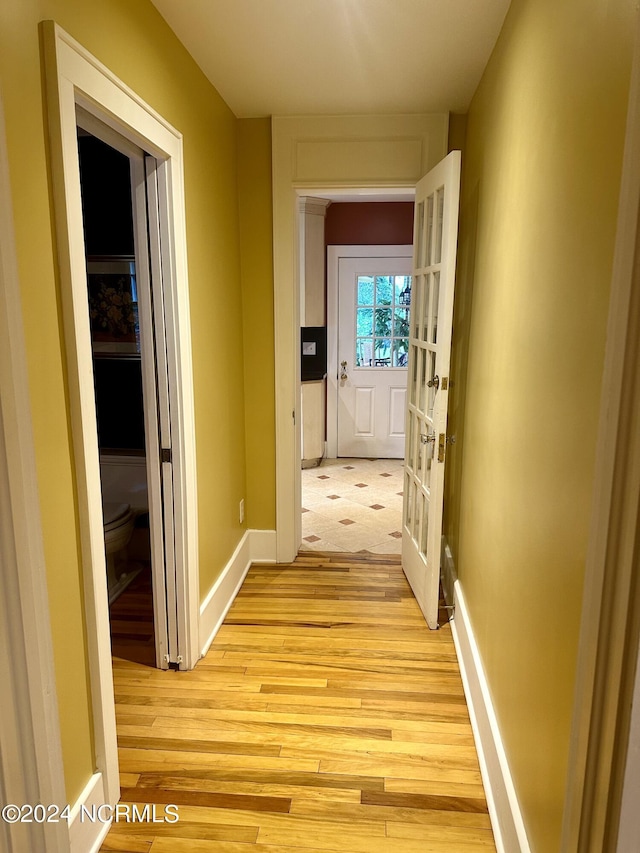 hallway featuring light hardwood / wood-style flooring