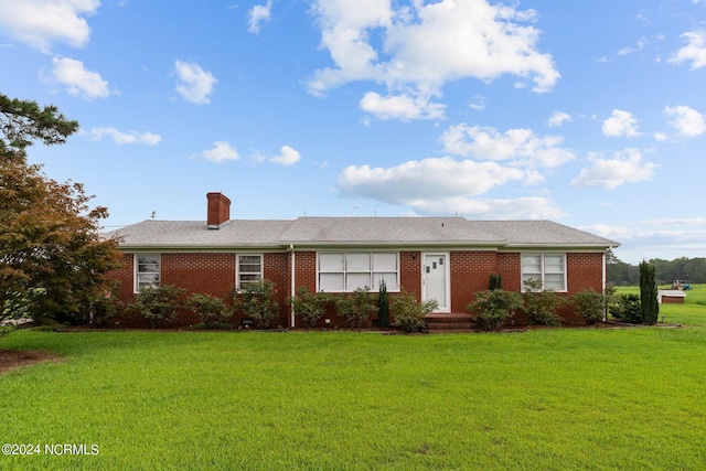 ranch-style house with a front lawn