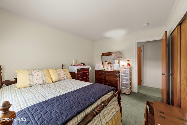 carpeted bedroom with ornamental molding and a closet