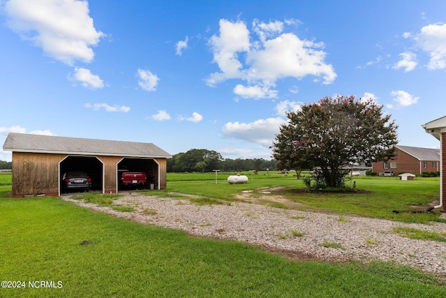 exterior space with an outbuilding and a lawn