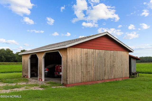 view of outdoor structure with a yard